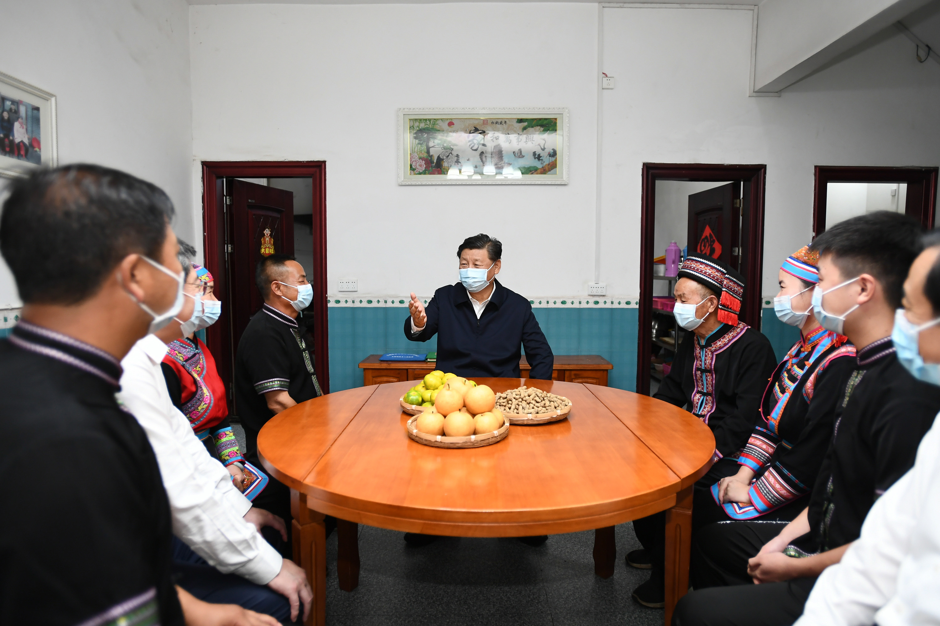Xi Jinping learns about progress in consolidating poverty eradication at a villager’s home in Hunan Province, Sept. 16.