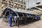 A worker welds a metal structure at the Reliance Naval and Engineering Ltd.&nbsp;shipyard in Pipavav.