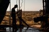 A worker waits to connect a drill bit on Endeavor Energy Resources LP's Big Dog Drilling Rig 22 in the Permian basin outside of Midland, Texas, U.S.