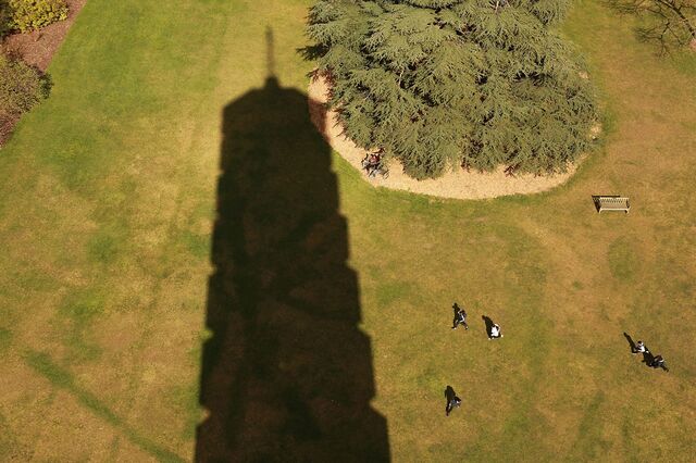Children play on the grass in the shadow of the Pagoda at The Royal Botanic Gardens, Kew on March 24, 2009 in London.