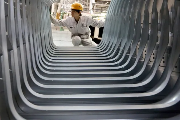 A worker on the production line at a plant operated by Dongfeng Peugeot-Citroën Automobile in Wuhan, China
