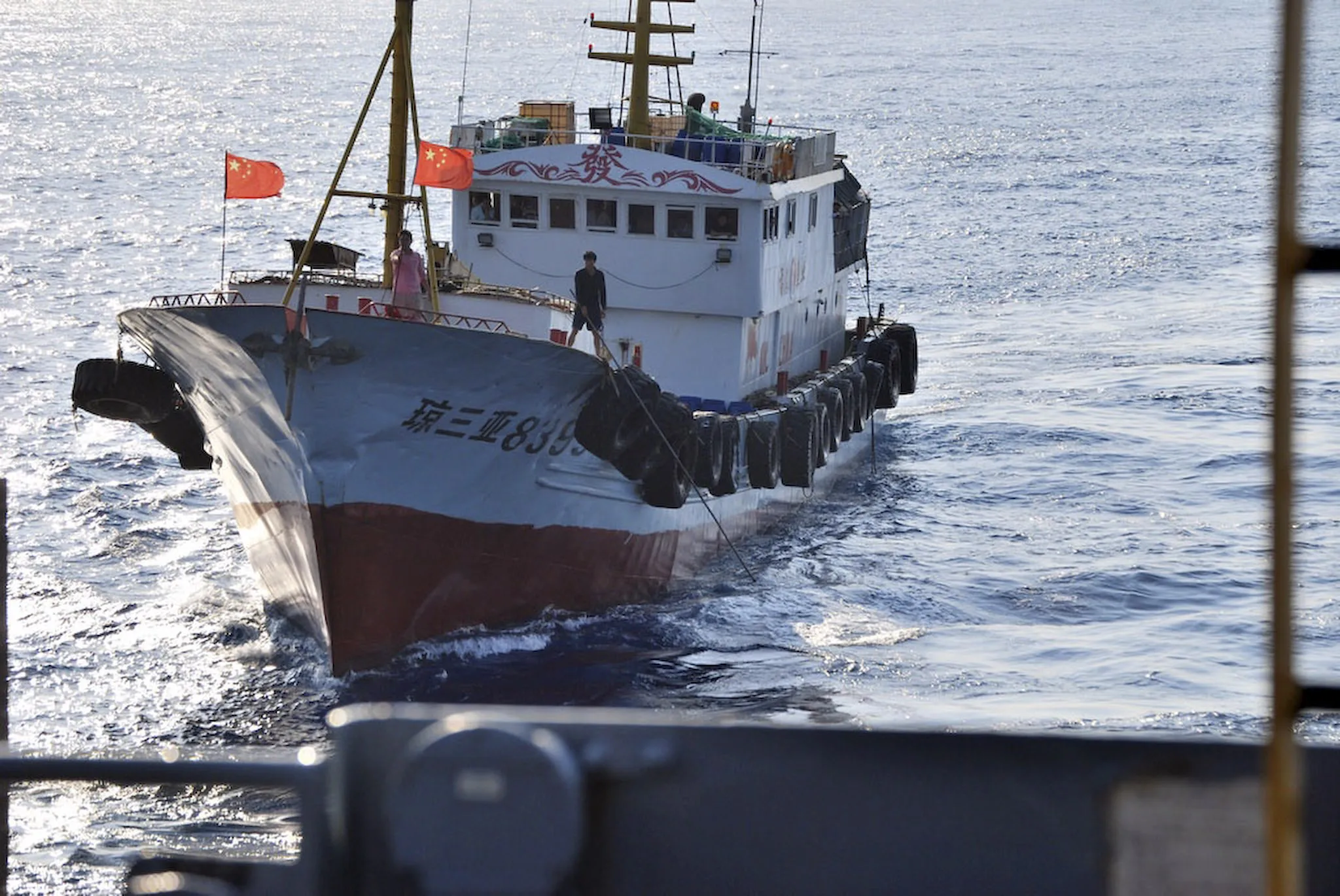 A Chinese trawler sailing near a US Navy ocean surveillance ship in the South China Sea on March 8, 2009.