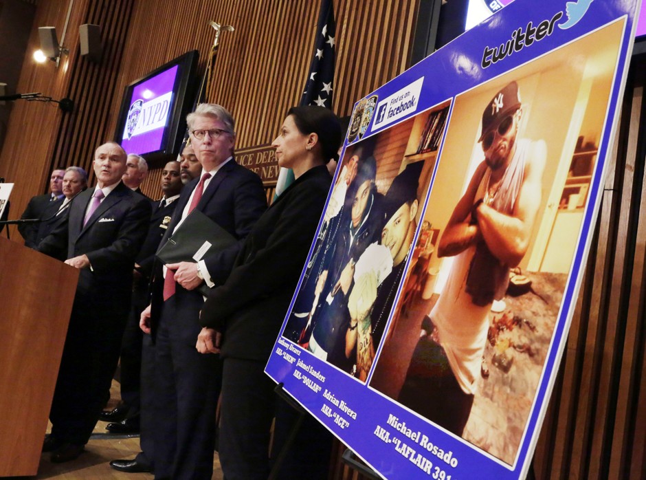 At a news conference in 2013, NYPD officials announce the arrests of several gang members. Monitoring the social media of reputed gang members has drawn criticism from civil liberties advocates. 