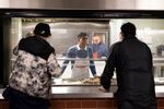 Rishi Sunak serves breakfast during a visit to&nbsp;The Passage homeless shelter in London, UK, on Dec. 23.