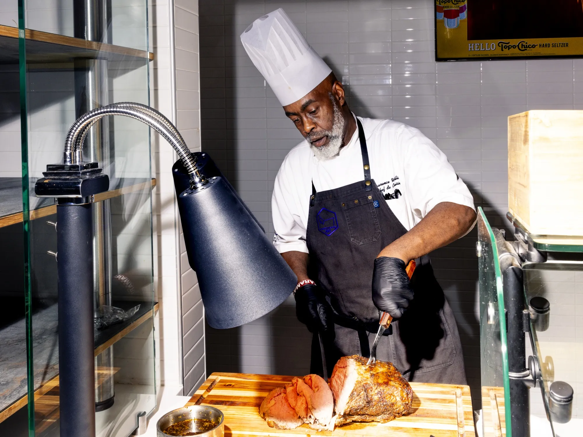 A chef cutting prime rib in the&nbsp;all-inclusive club at the ASU football stadium.