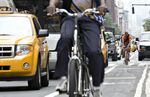 Bicyclists ride in New York.
