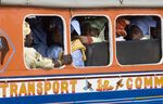 People travel in a bus locally known as &quot;car rapide&quot; in Senegal's capital Dakar.