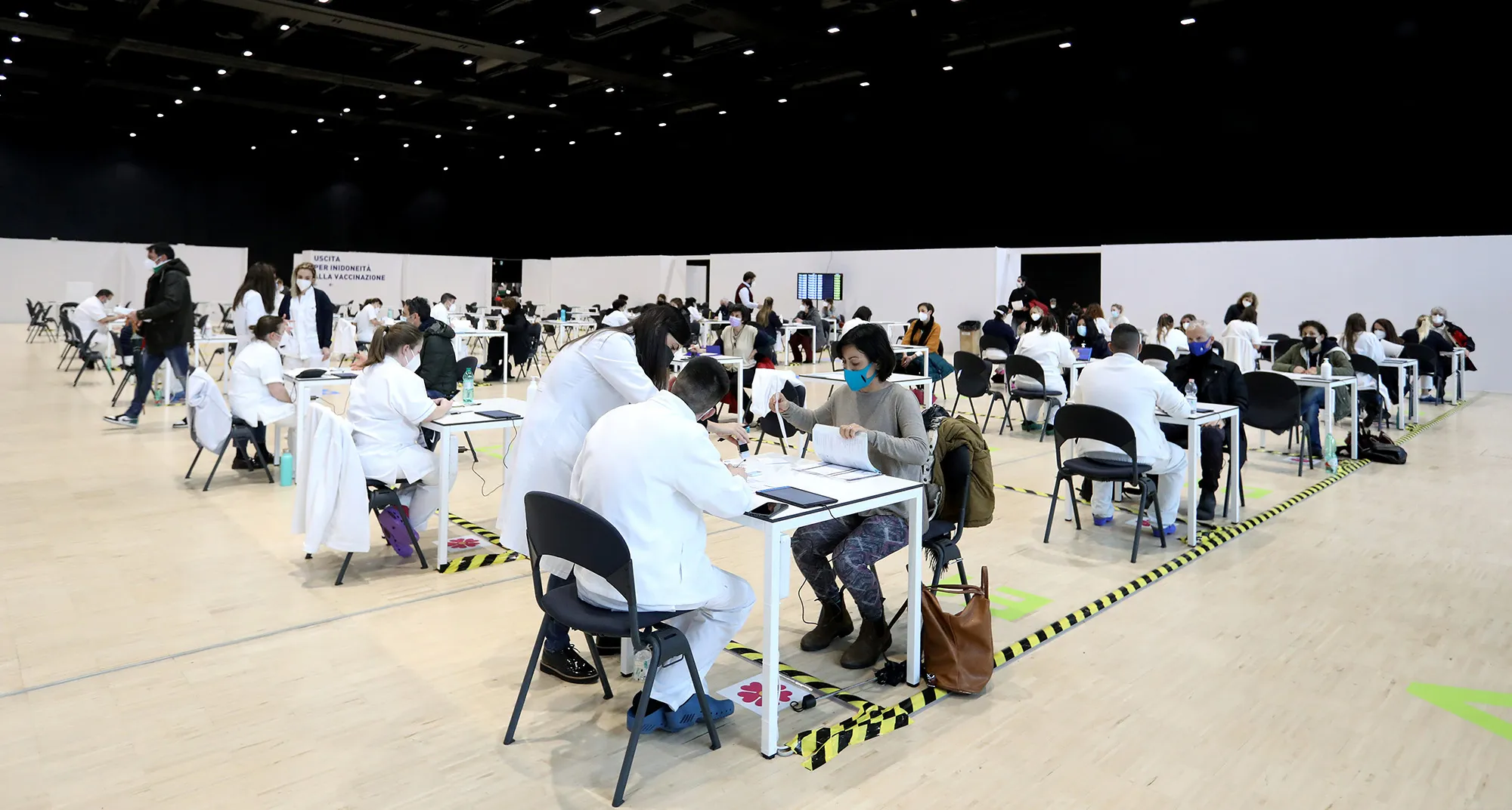 Health workers register people at a Covid-19 vaccination center in Rome.