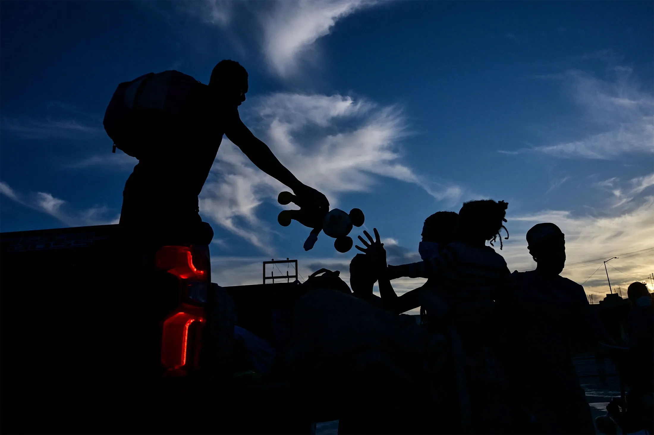 Haitian migrants get off a truck as they arrive at a&nbsp;shelter after leaving a makeshift camp in Ciudad Acuna,&nbsp;Mexico, on Sept.&nbsp;24.