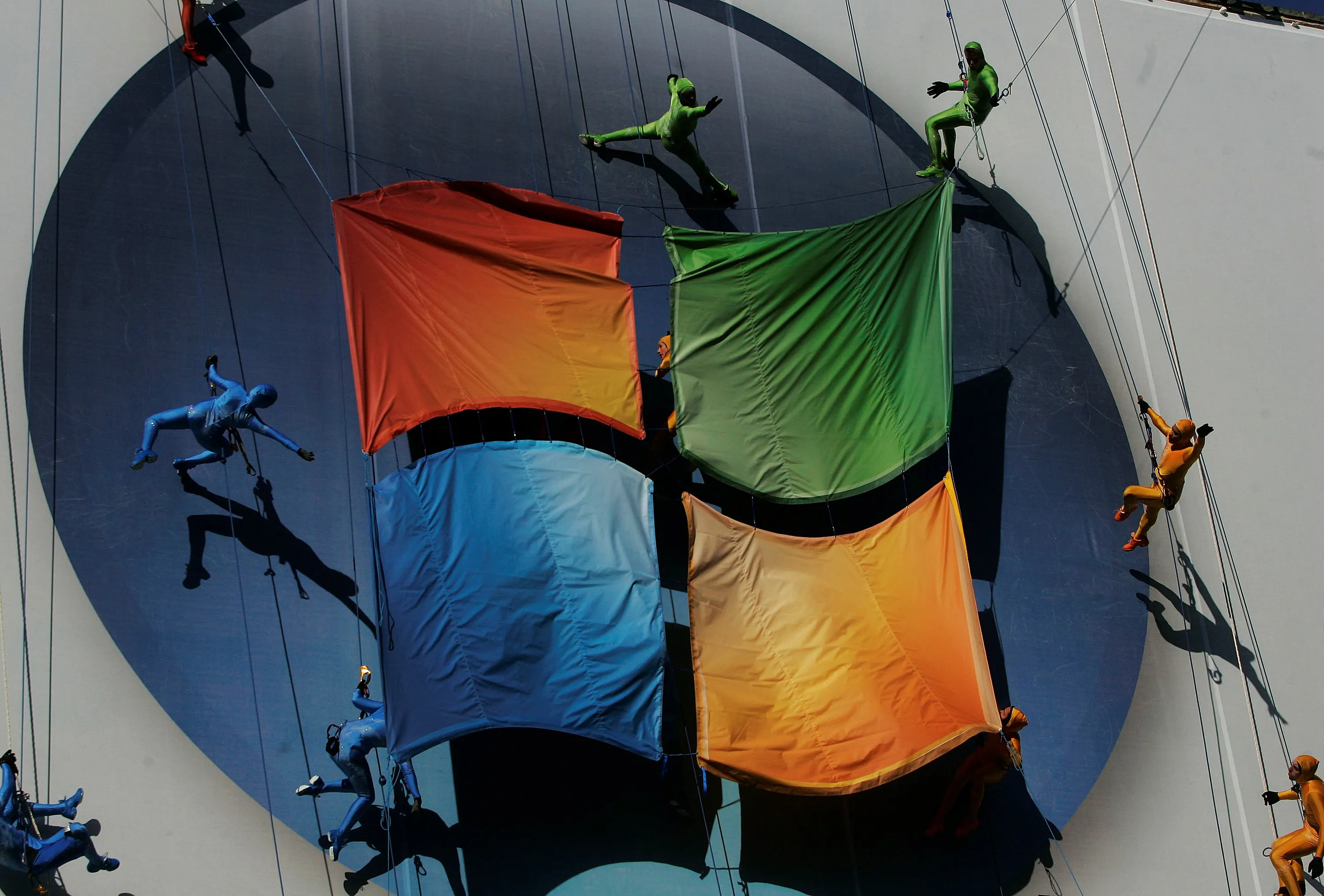 Performers dance on a poster promoting a new version of Microsoft Windows in Manhattan.