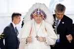 Pope Francis wears a traditional headdress that was gifted to him by indigenous leaders following his apology during his visit in Maskwacis, Canada, on July 25.