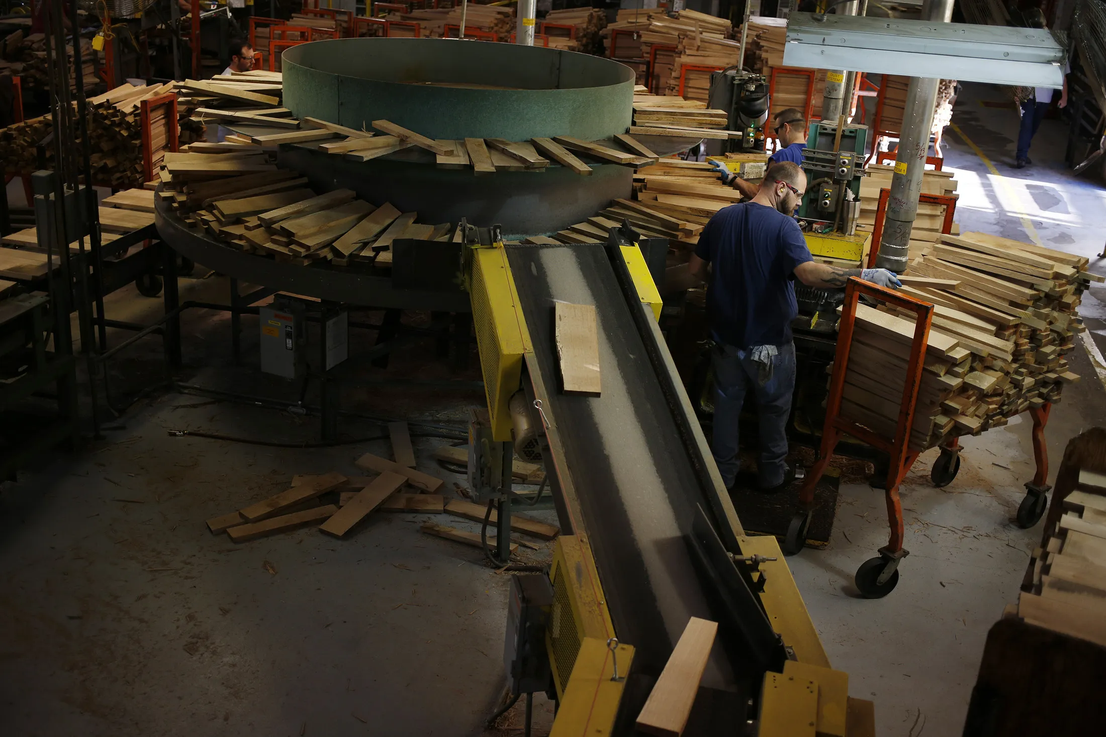 A factory worker selects pieces of white oak to be manufactured into bourbon barrels at the Brown-Forman Corp. cooperage facility in Louisville, Kentucky, on April 20, 2017.
