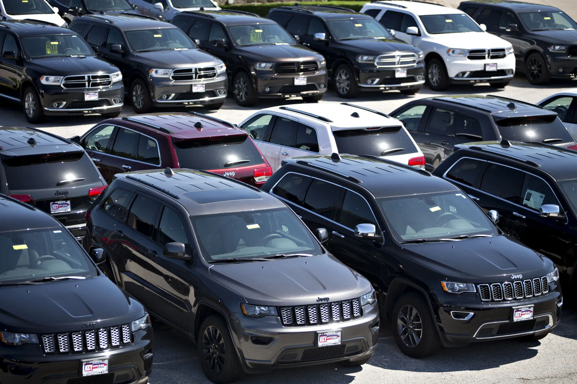 Jeep and Dodge vehicles are displayed for sale at a Fiat Chrysler Automobiles (FCA) car dealership in Moline, Illinois, U.S., on Saturday, July 1, 2017.