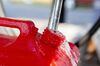 A customer fills a gas container at a Marathon Petroleum Corp. gas station in Peoria, Illinois, U.S., on Tuesday, July 24, 2018. Marathon Petroleum Corp. is scheduled to release earnings figures on July 26.