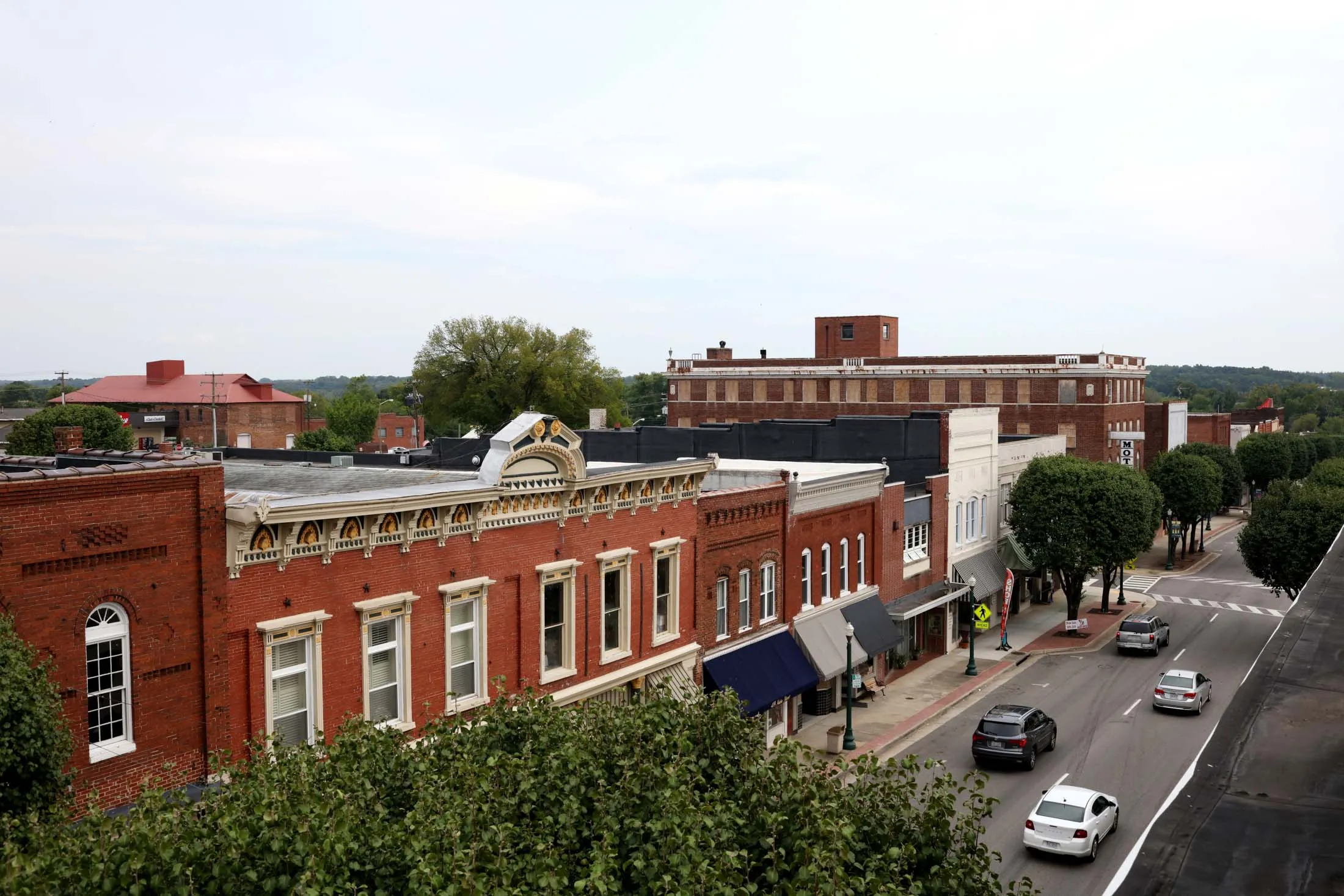 A view of downtown South Boston, VA where old buildings show signs of new life. Through a combination of state and federal aid, tobacco settlement funds, and town leadership, South Boston, Virginia, has pushed through an otherwise crippling loss of manufacturing jobs over recent decades.