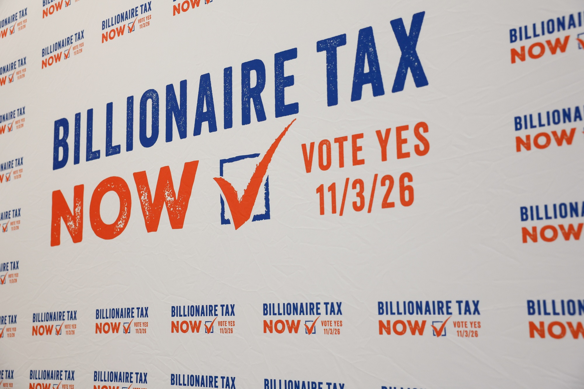Signage in support of the Billionaire Tax Now coalition 