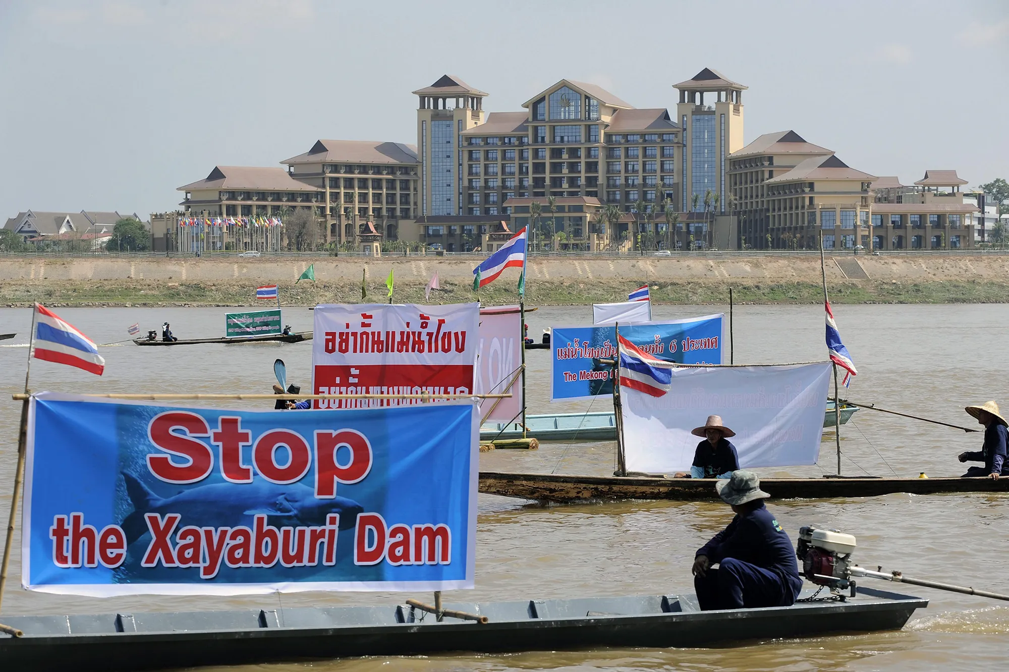 Thai activists and villagers who are affected by the controversial Xayaburi dam protest with banners on the Mekong river in Nong Khai province, Thailand, in November 2012.
