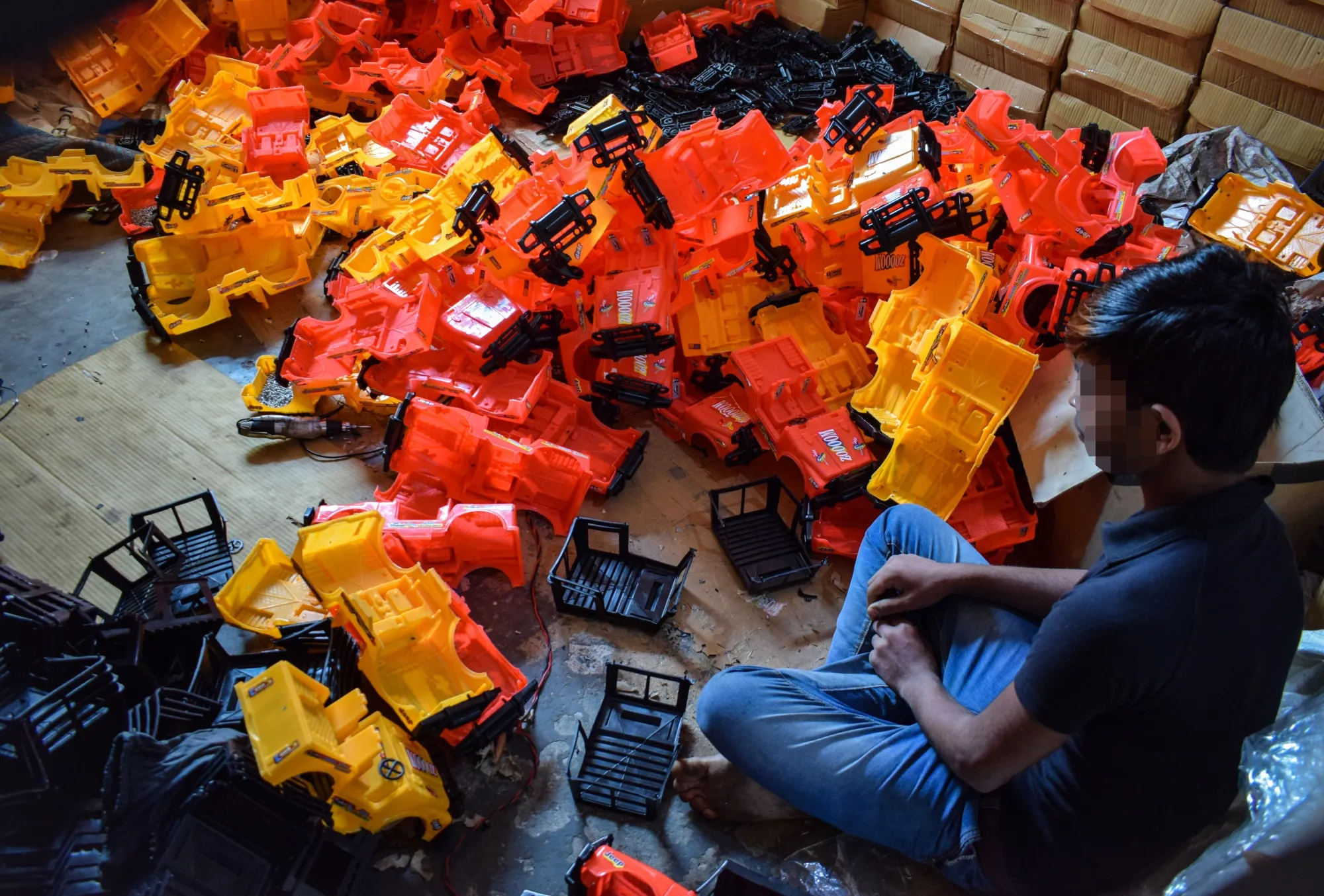 A child works at a toy factory.