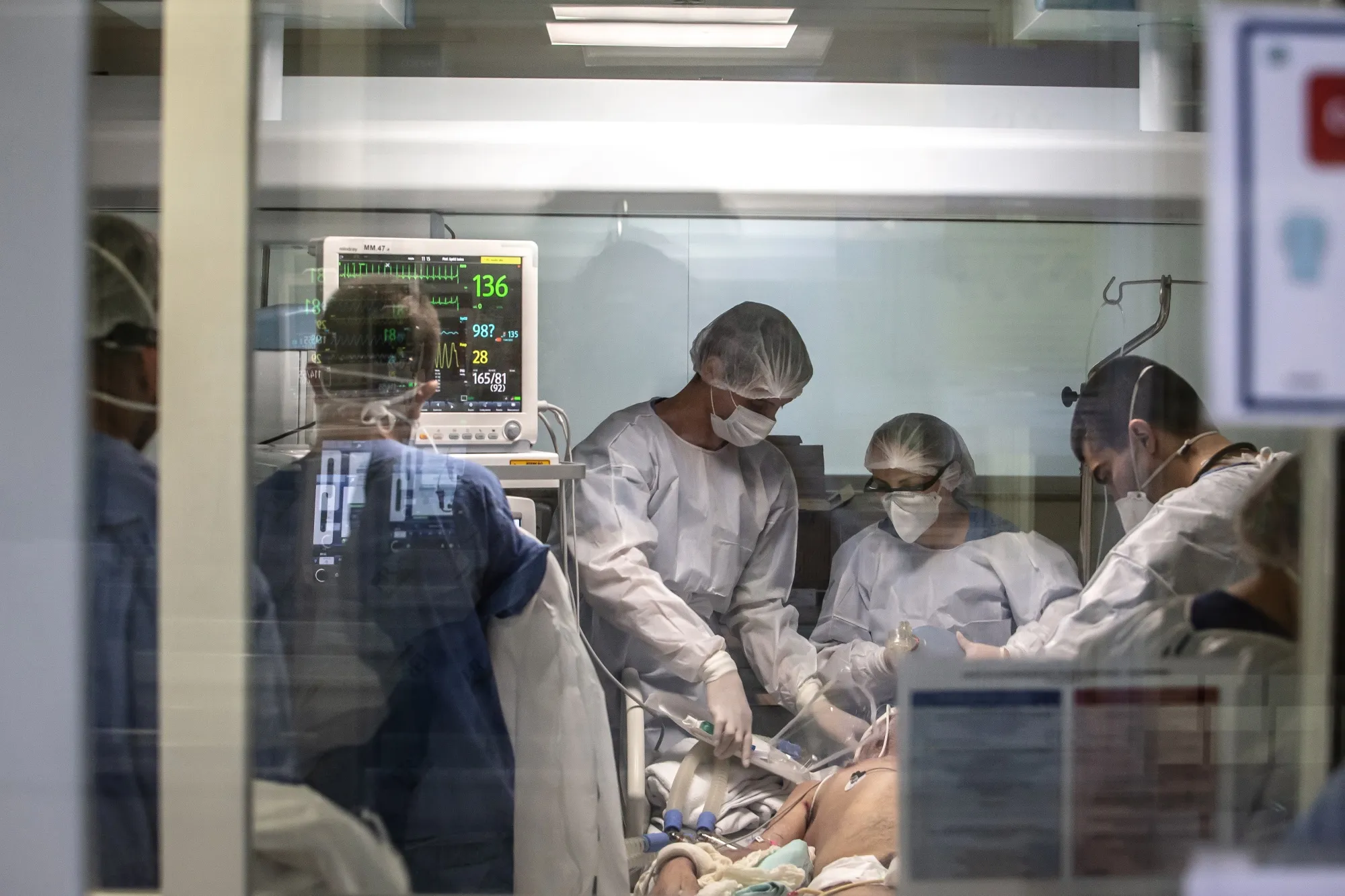 Doctors and nurses work to resuscitate a patient in the Covid-19 ICU at a hospital in Sao Paulo.