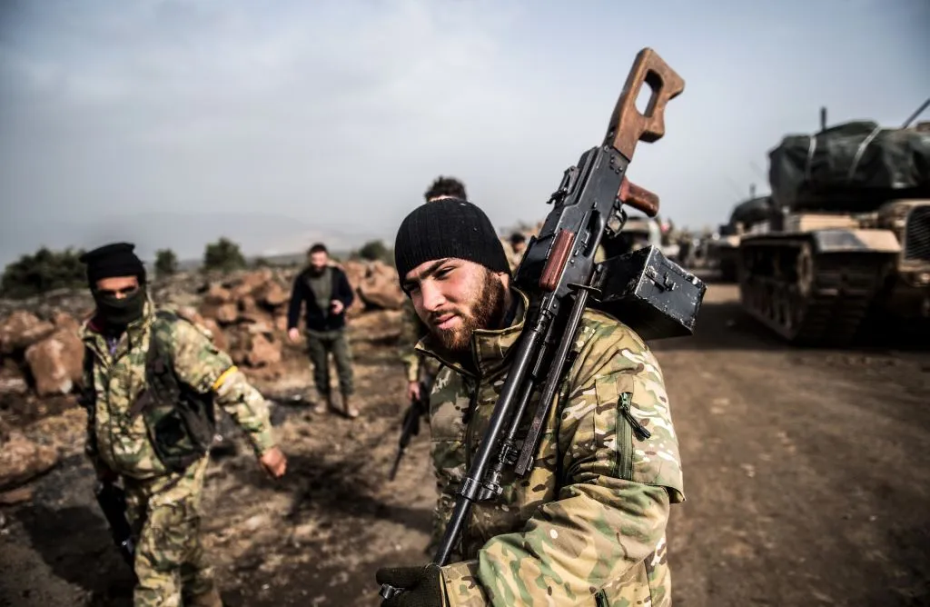 Turkish troops advance on a Kurdish hold in Syria.
