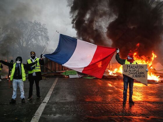 Macron Cuts Solitary Figure as Chaos Swirls