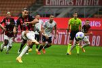 AC Milan’s Zlatan Ibrahimovic scores on a penalty kick during the Italian Serie A football match on Sept. 21.