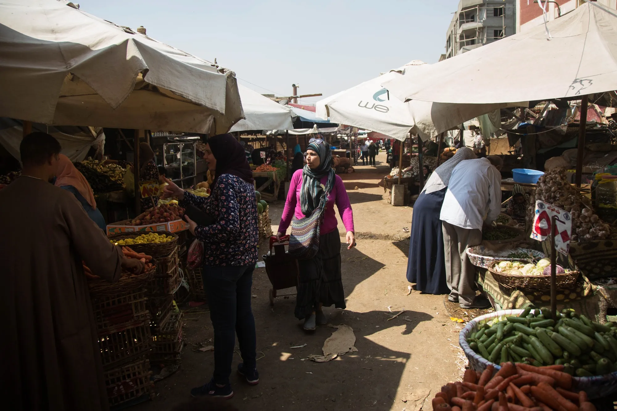 Customers shop for fresh fruit and vegetables at the Al-Manhal market in the Nasr city district of Cairo, Egypt.