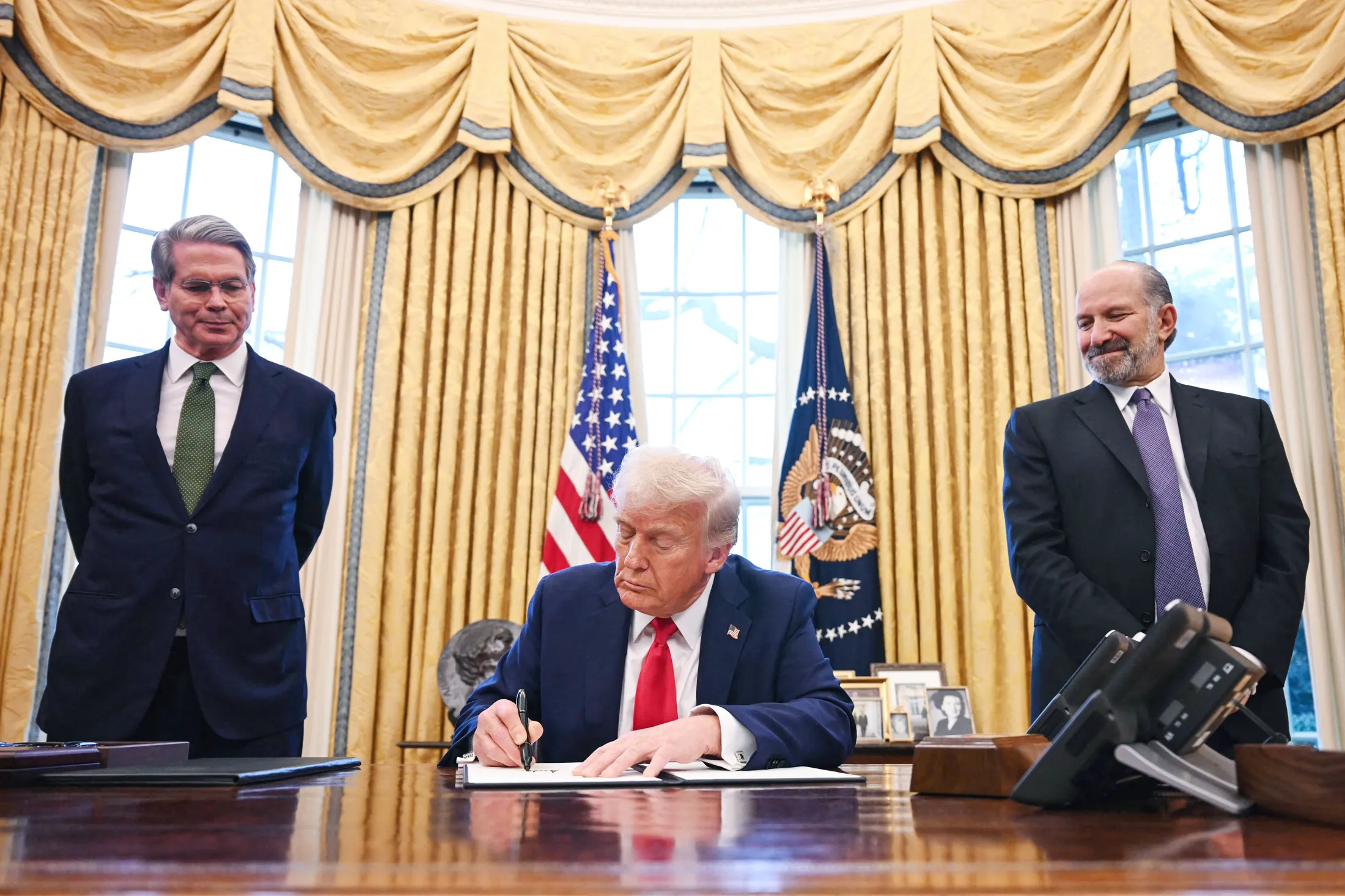 US President Donald Trump, alongside Scott Bessent, left, and Howard Lutnick at the White House in February.