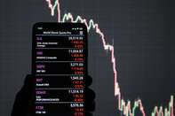 In this photo illustration Stock markets indices of Dow