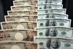 Japanese 10,000 yen banknotes and U.S. one-hundred dollar banknotes