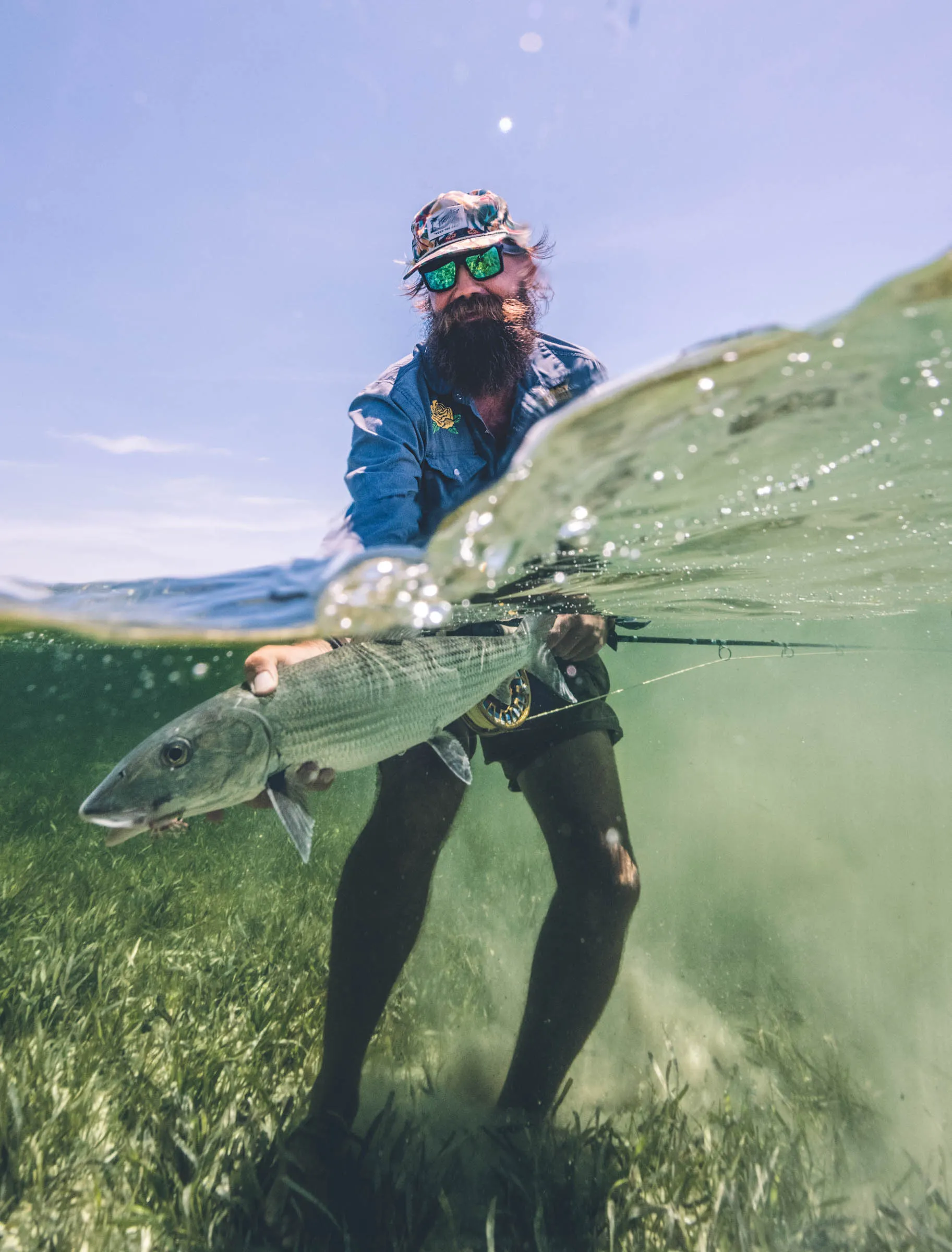Oliver White, a guide from North Carolina, gets the money shot with a bonefish in the Marls, Bahamas.