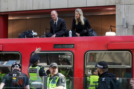 Climate Protest Blocks Rail Services to London’s Canary Wharf