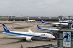 All Nippon Airways Co. (ANA) aircraft stand on the tarmac at Haneda Airport in Tokyo, Japan, on Tuesday, July 28, 2020.