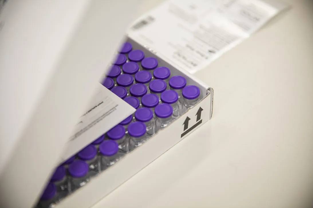 Boxed Pfizer BioNTech vaccine vials.