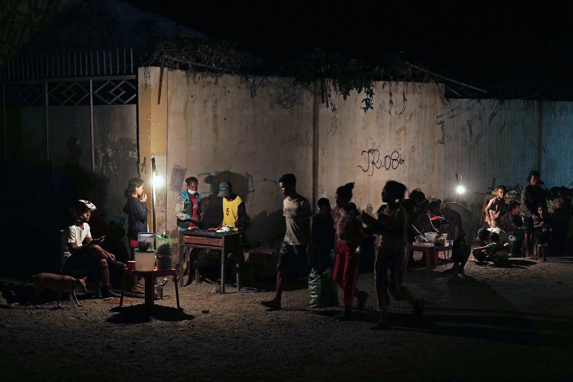 Temporary stall lights illuminate a night market in Dili, Timor-Leste, on Aug. 22.