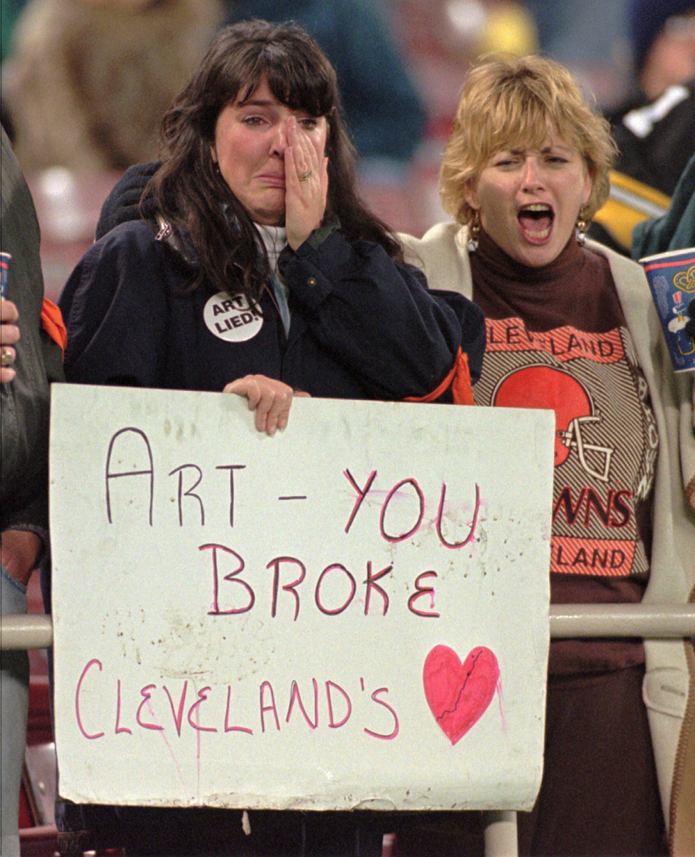 Cleveland Browns owner Art Modell waves to the crowd waiting to hear that  the Browns will move to Baltimore as Maryland Gov. Parris Glendening looks  on in Baltimore, Monday, Nov. 6, 1995. (