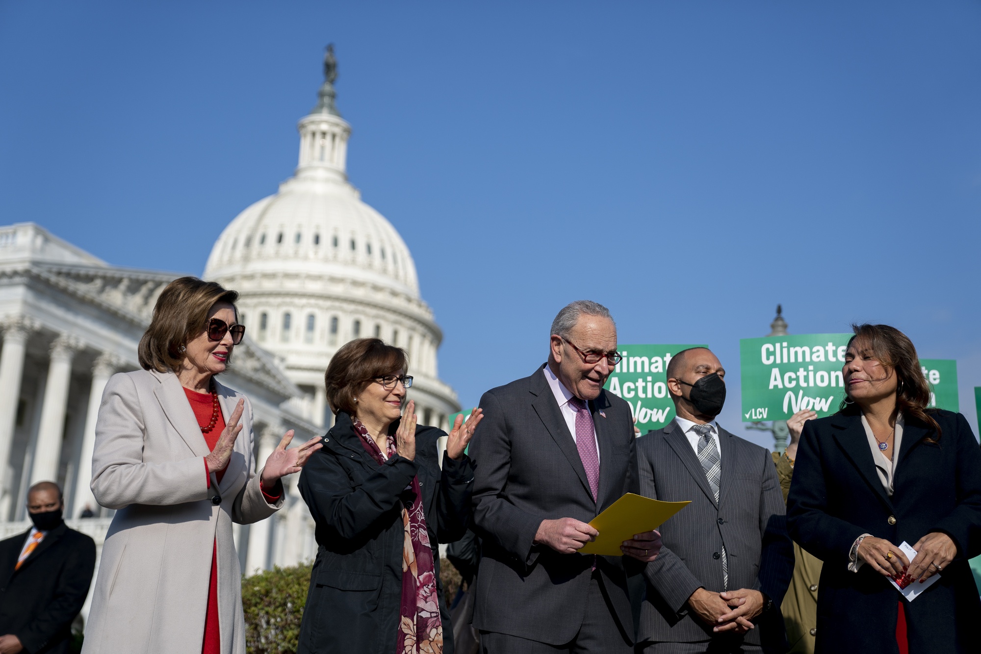 Senate Majority Leader Chuck Schumer, center,&nbsp;during a news conference on climate action outside the US Capitol in November 2021.