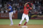 Los Angeles Angels' Luis Rengifo celebrates his two-run double during the eighth inning of the team's baseball game against the Texas Rangers on Saturday, July 30, 2022, in Anaheim, Calif. (AP Photo/Jae C. Hong)