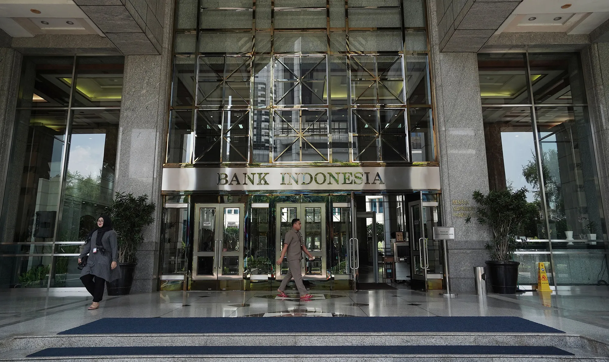 A sign sits above the entrance to the Bank Indonesia headquarters in Jakarta.