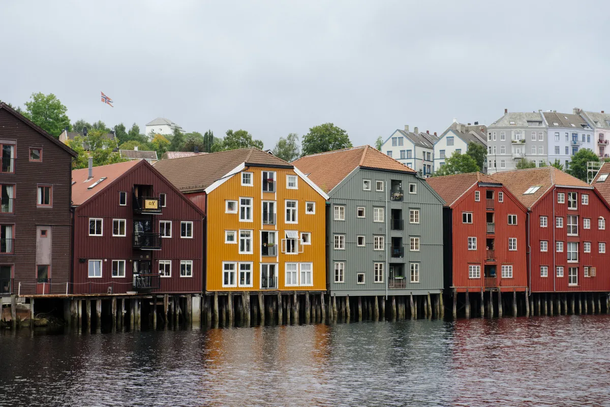 Old warehouses on the waterfront of the Nidelven river in Trondheim, Norway.