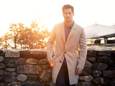 An unlined, cashmere topcoat such as this one on Henrique by Theory will provide plenty of warmth without the weight. Plus, it's long enough to cover his suit jacket on game day but still short enough to allow him freedom of movement (of the off-duty variety).
