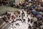 Riot police confront demonstrators inside New Town Plaza shopping mall in Shatin, Hong Kong.