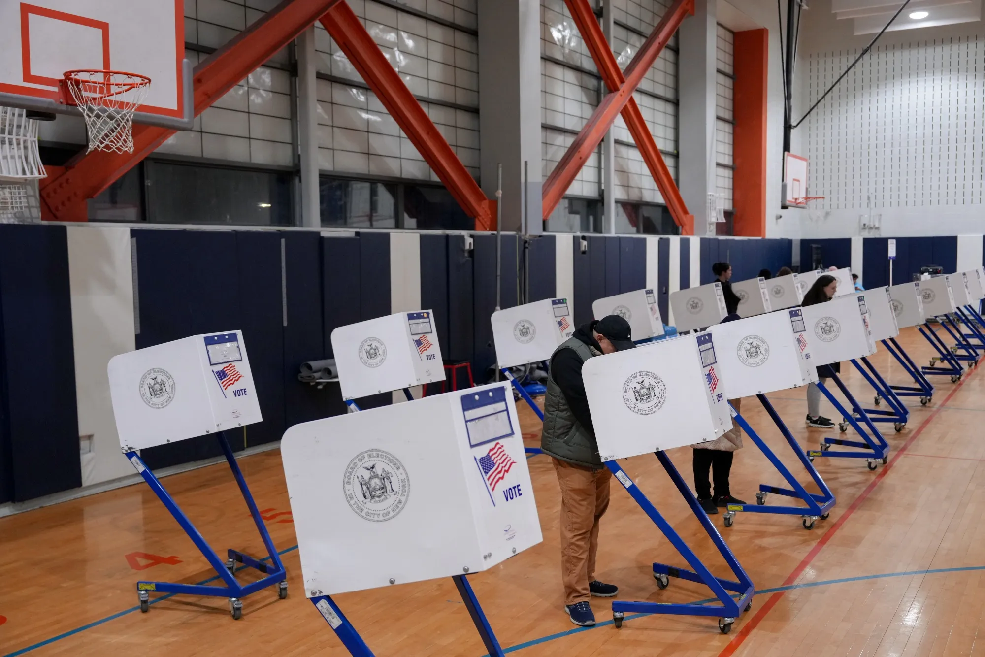 Voters mark their ballots at a polling station inside Frank Sinatra School of the Arts High School in the Queens borough of New York on Nov. 4.
