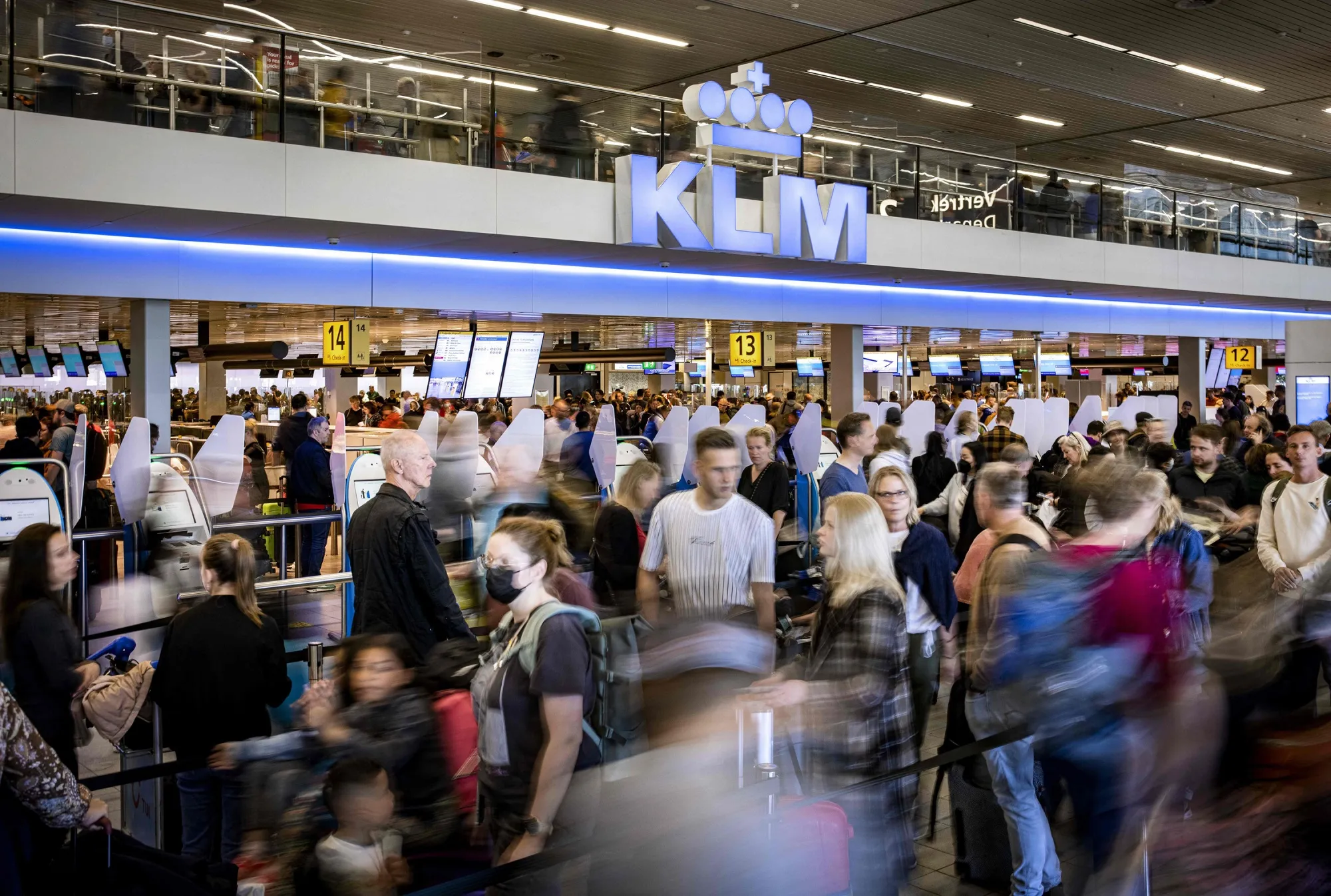 Travelers wait in a departure hall of Schiphol airport near Amsterdam&nbsp;on April 23.&nbsp;