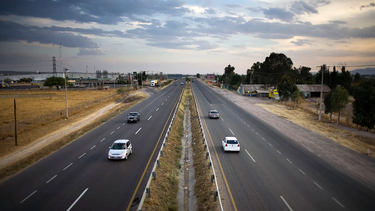 Cars move along a highway in Aguascalientes, Mexico, on March 16, 2009.
