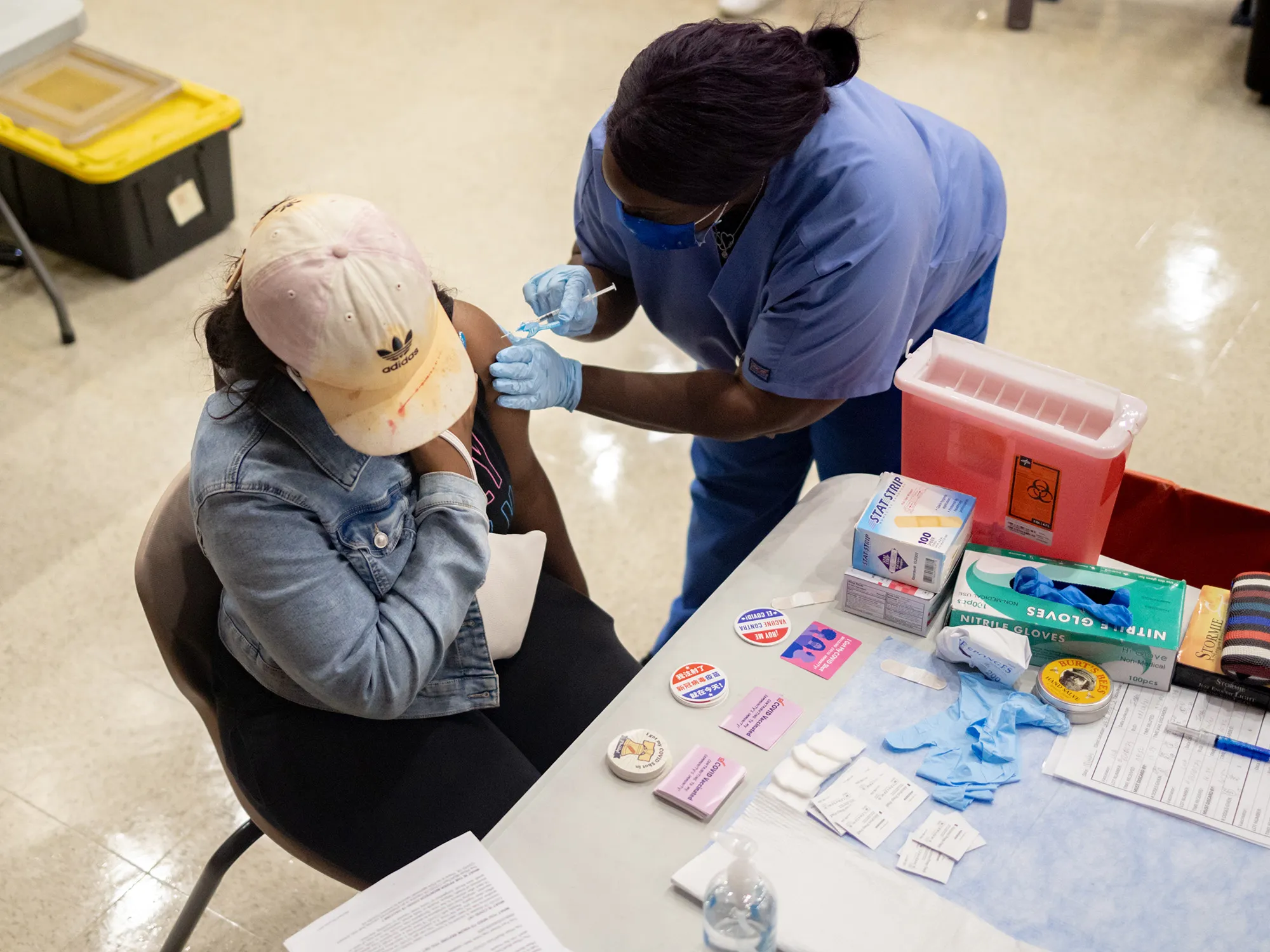A healthcare worker gives a Covid-19 vaccine&nbsp;in Philadelphia&nbsp;on Aug. 4.