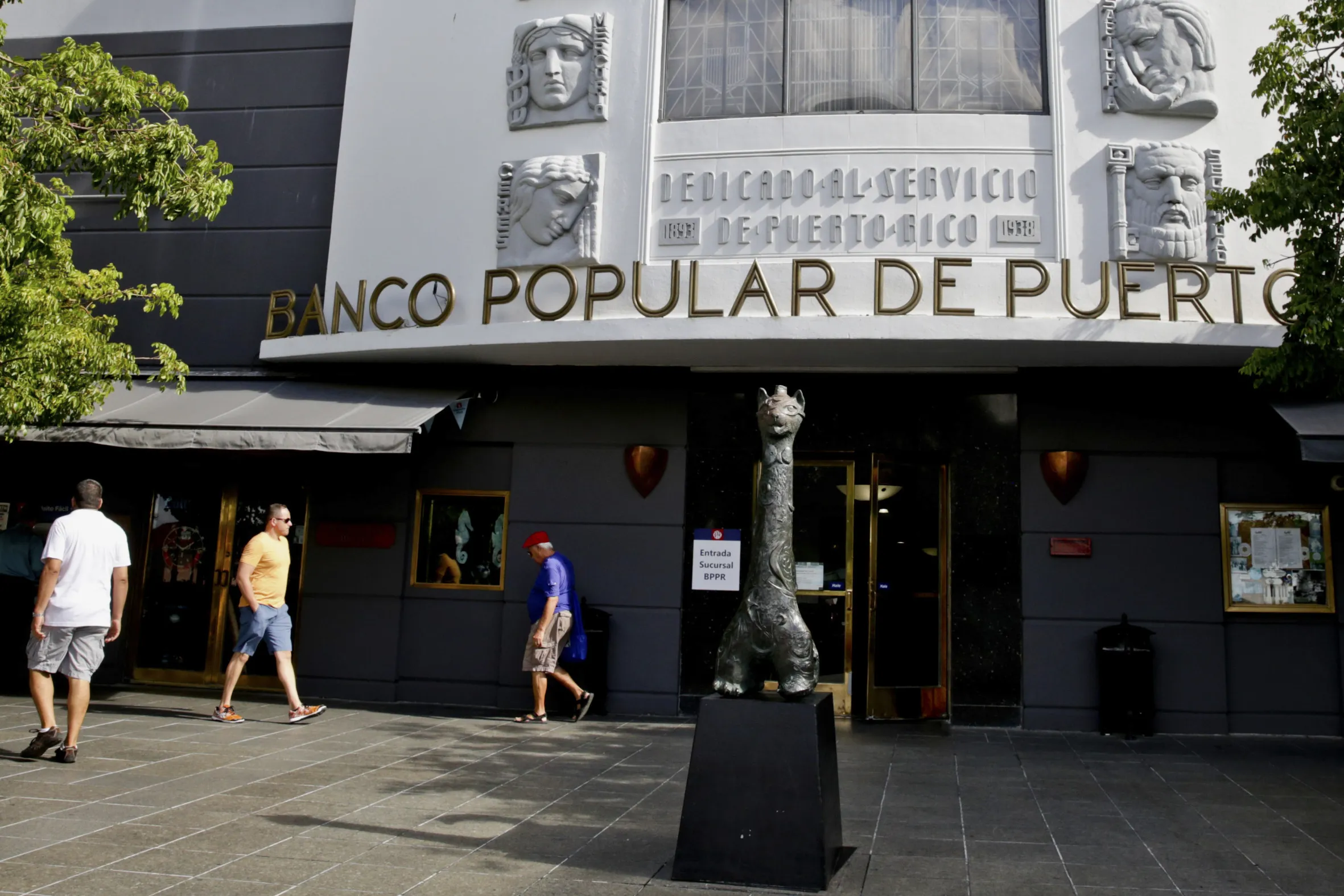 Pedestrians walk past a Banco Popular de Puerto Rico (BPPR) branch in Old San Juan, Puerto Rico, in&nbsp;2015.&nbsp;