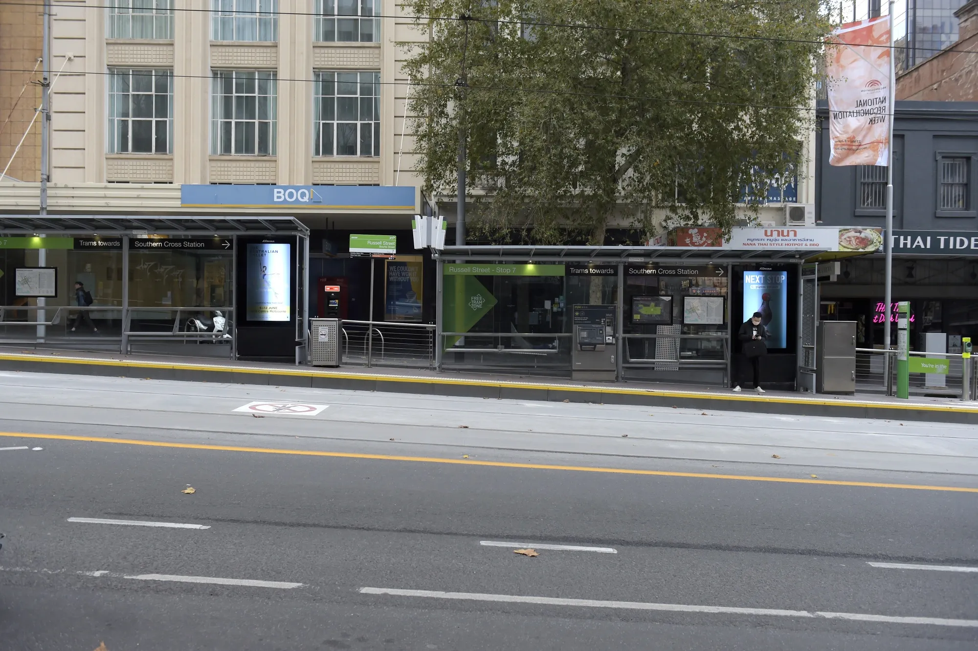 A passenger waits at a tram stop during a lockdown in Melbourne on May 28.