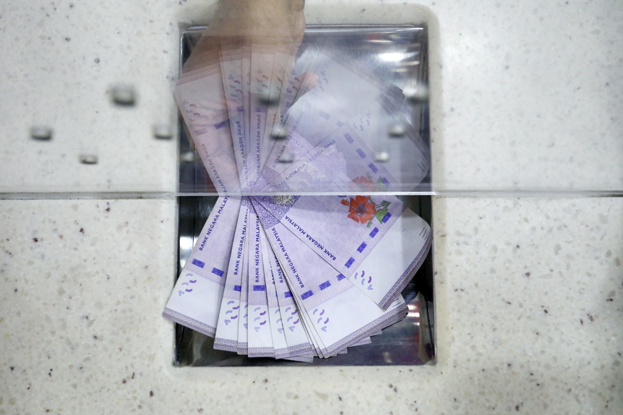 The ringgit rose as much as 0.5% to 4.6630 per dollar on Friday.