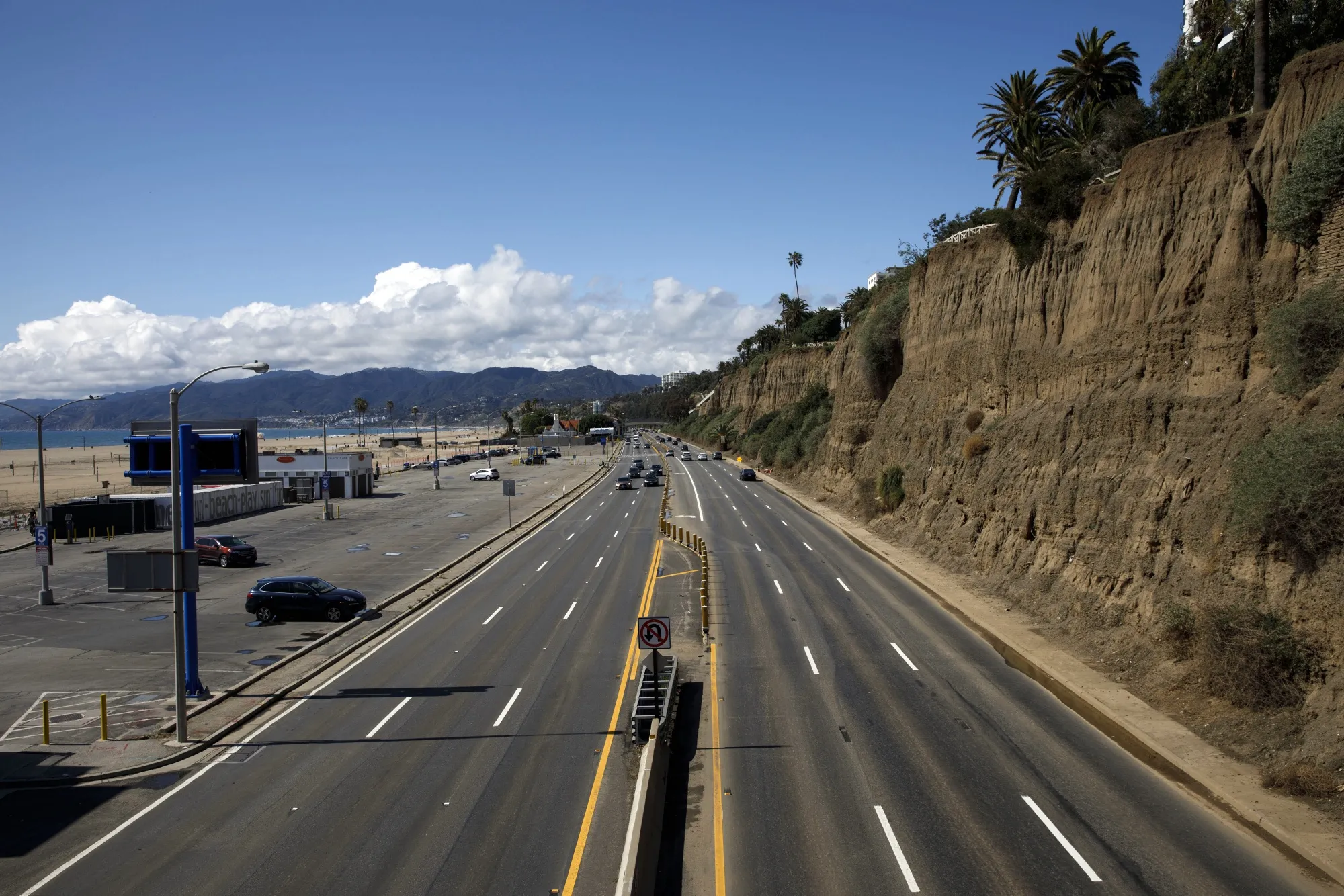 Vehicles drive in light traffic along the Pacific Coast Highway&nbsp;in Santa Monica, California on March 19.